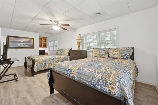 a bedroom with double bed and a window