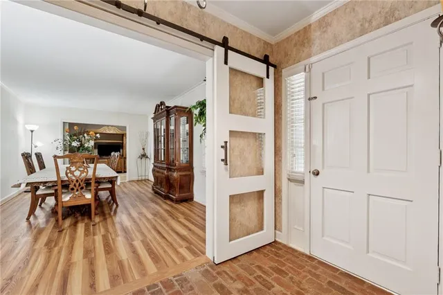 a view of a livingroom with furniture and hardwood floor