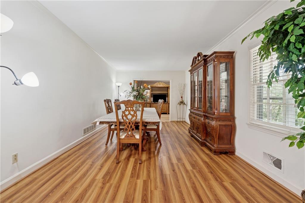 1387 Springdale Road Gainesville, GA 30501 - Photo 5 of 49 a view of a dining room with furniture window and wooden floor