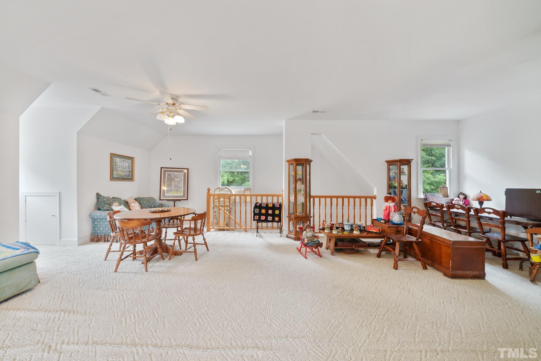 920 Windrow Lane Raleigh, NC 27603 - Photo 32 of 40 a dining room with furniture and a livingroom