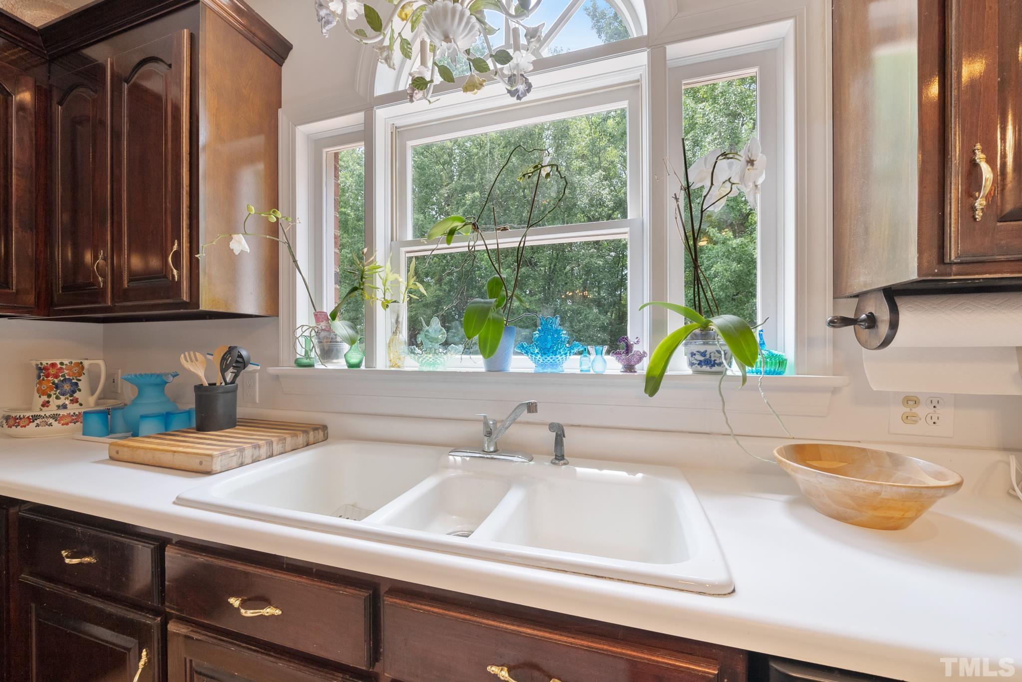 920 Windrow Lane Raleigh, NC 27603 - Photo 10 of 40 a kitchen with a sink and a window