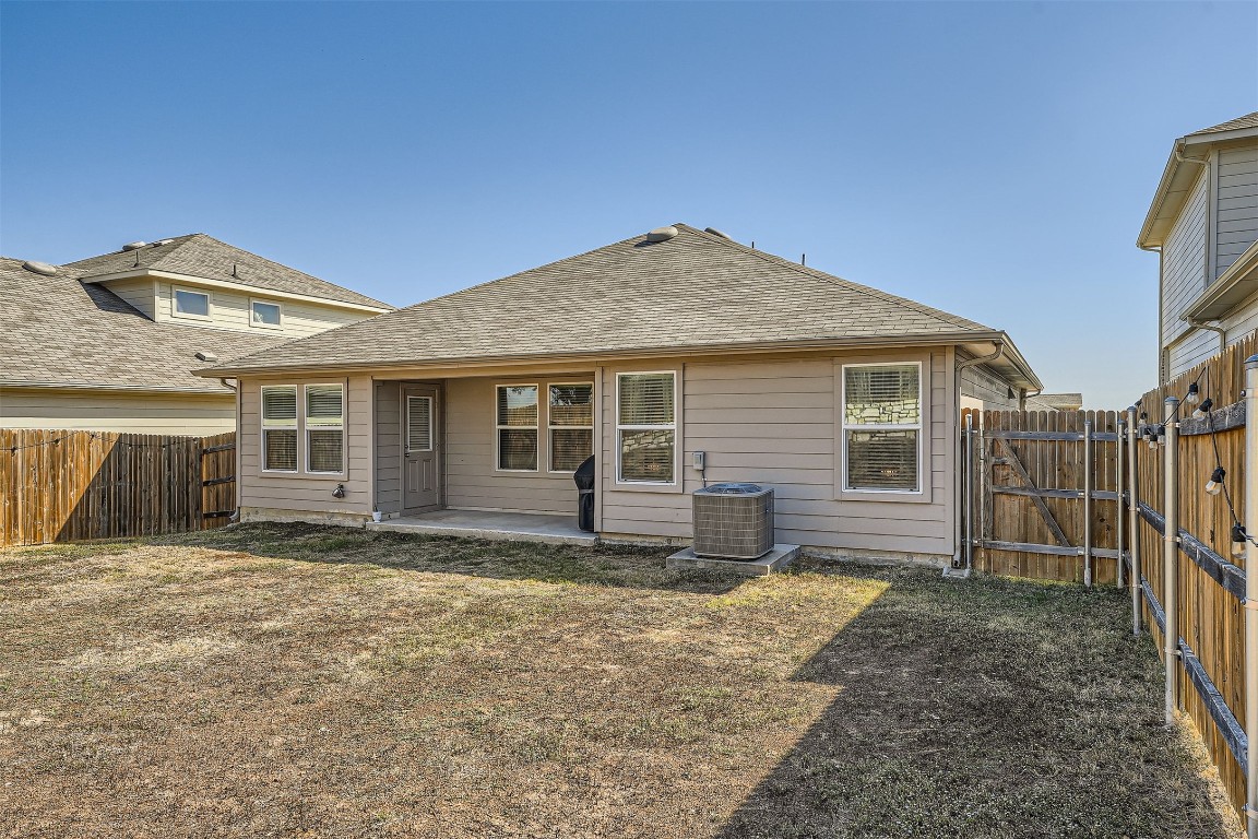 6404 Diamondleaf Bend Austin, TX 78724 - Photo 25 of 29 Rear view of house featuring a patio area, a fenced backyard, a gate, and roof with shingles
