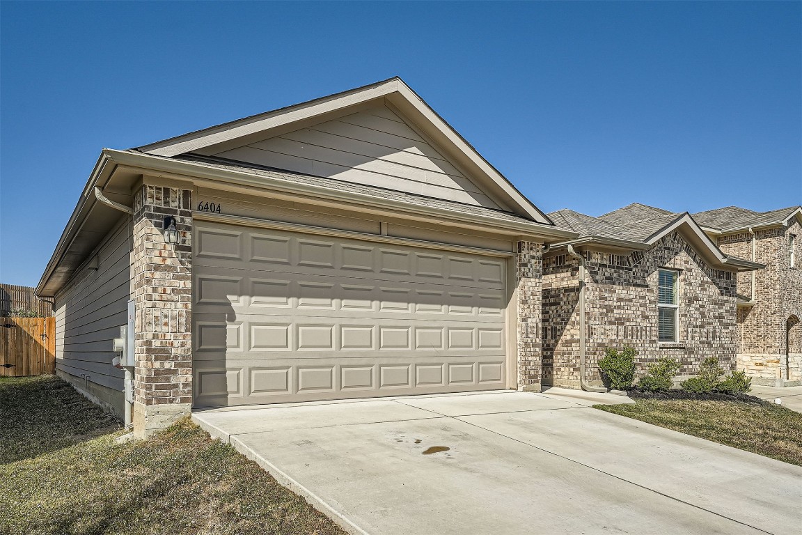 6404 Diamondleaf Bend Austin, TX 78724 - Photo 27 of 29 Ranch-style home featuring driveway, a garage, and brick siding