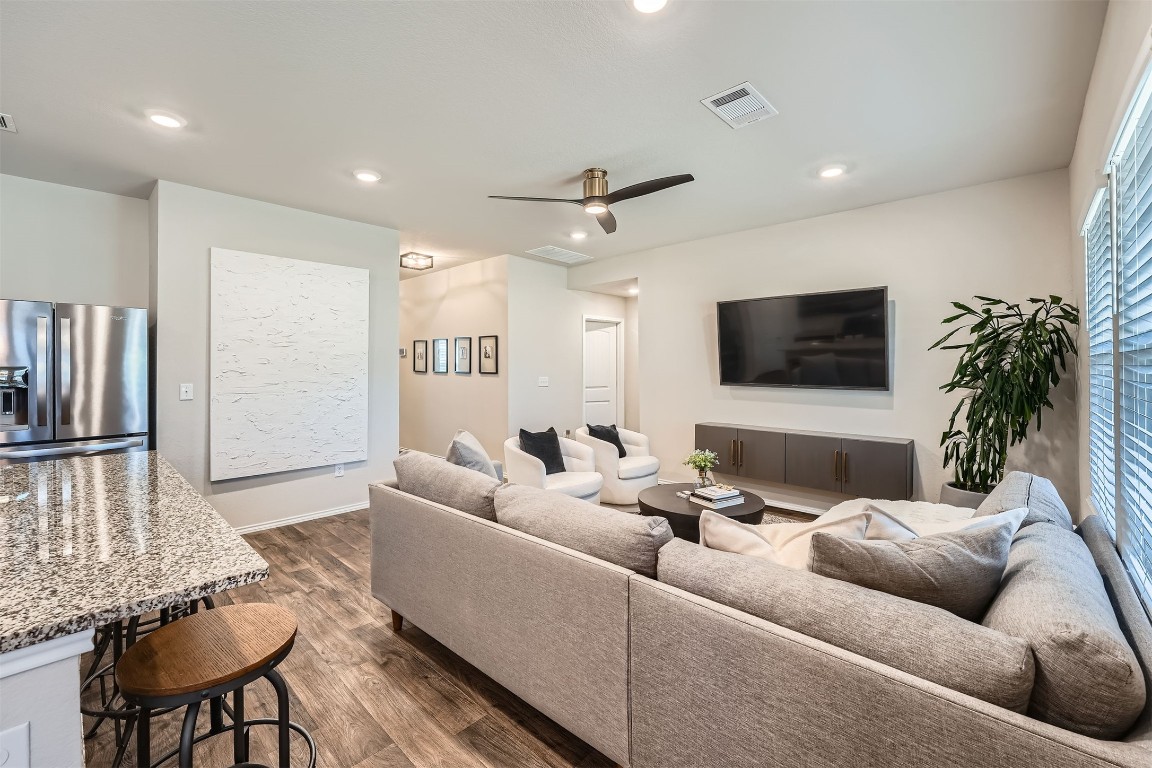 6404 Diamondleaf Bend Austin, TX 78724 - Photo 4 of 29 Living room with ceiling fan, dark wood-style flooring, and recessed lighting