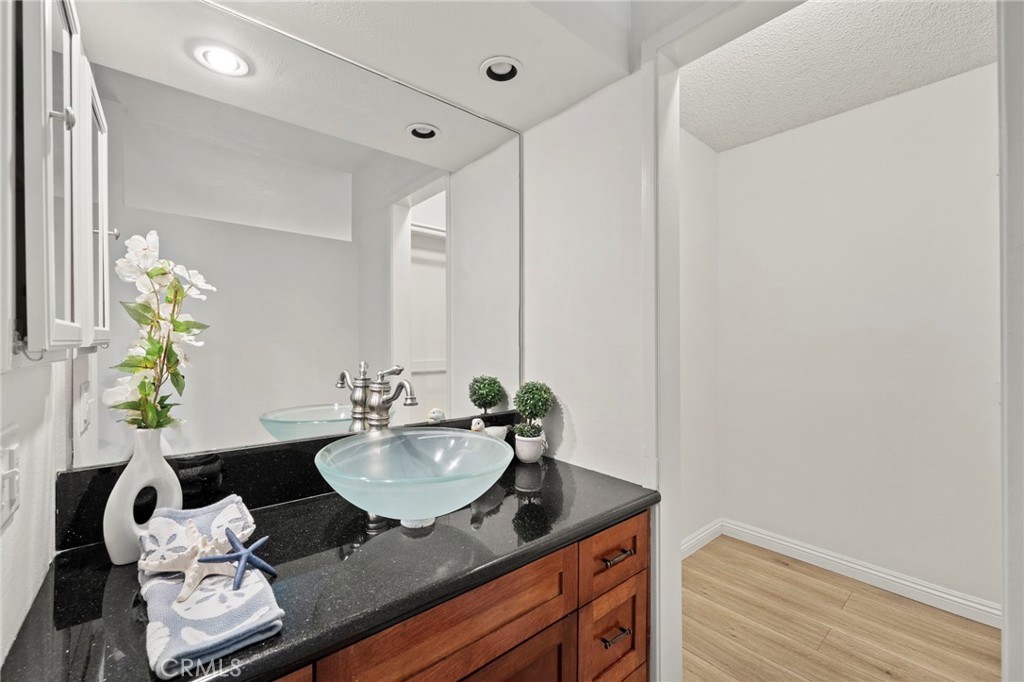 63 Streamwood Irvine, CA 92620 - Photo 19 of 36 Private vanity area with a vessel sink.