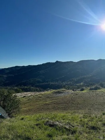 a view of ocean and mountain