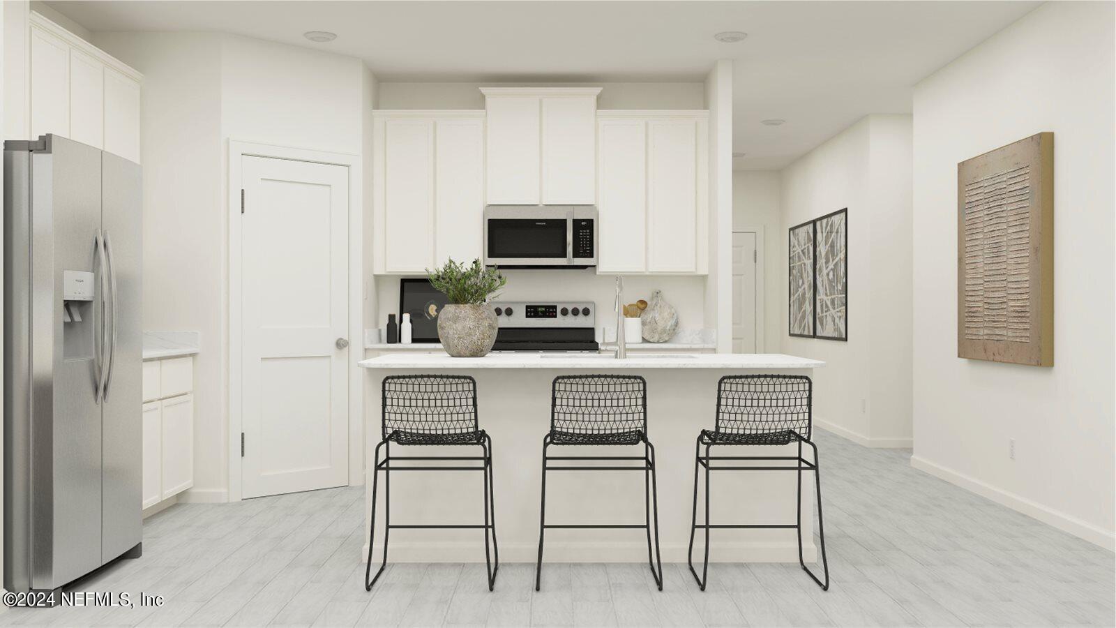 117 Round Robin Run St. Johns, FL 32259 - Photo 2 of 17 a kitchen with stainless steel appliances kitchen island granite countertop a refrigerator and microwave