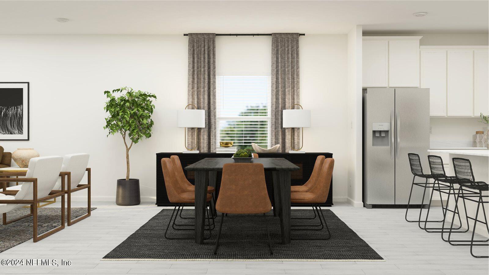 117 Round Robin Run St. Johns, FL 32259 - Photo 4 of 17 a view of a dining room with furniture and a potted plant