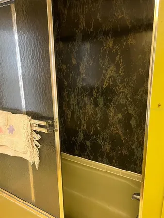 a spacious bedroom with a bed and a window