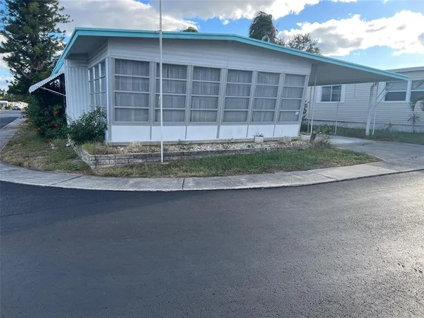 a view of a house with a yard and garage