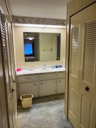 a bathroom with a shower and a sink