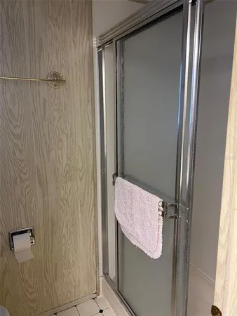 a bedroom with a large bed and a dresser