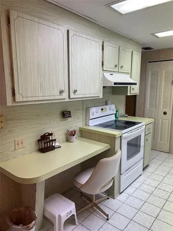 a kitchen with a sink cabinets and appliances