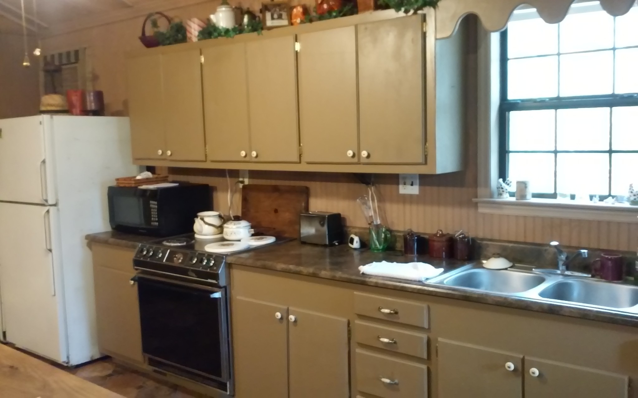 8200 Bethel Road Prospect, TN 38477 - Photo 26 of 50 a kitchen with stainless steel appliances granite countertop a sink stove and refrigerator