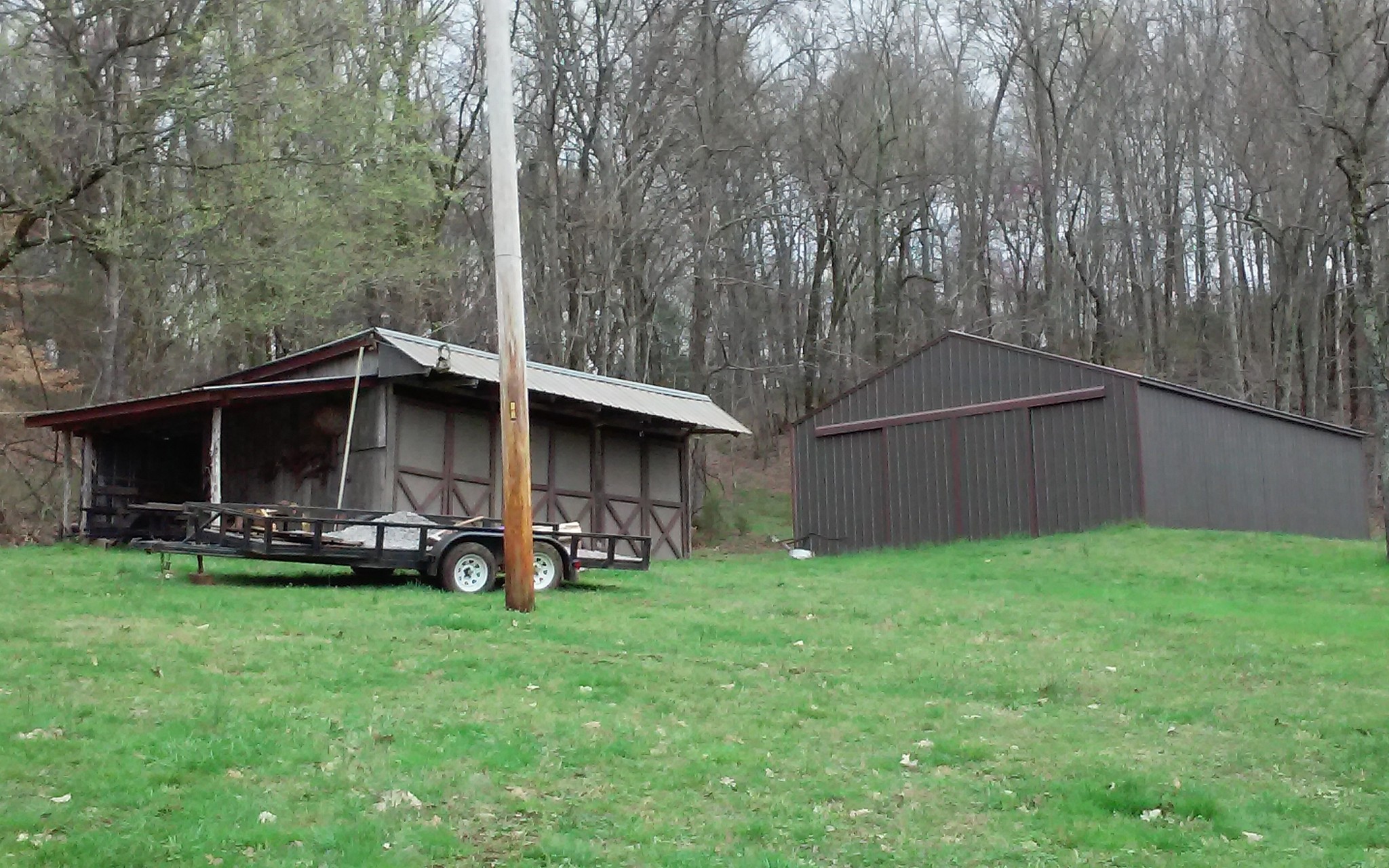 8200 Bethel Road Prospect, TN 38477 - Photo 36 of 50 a view of a backyard with wooden fence and a bench