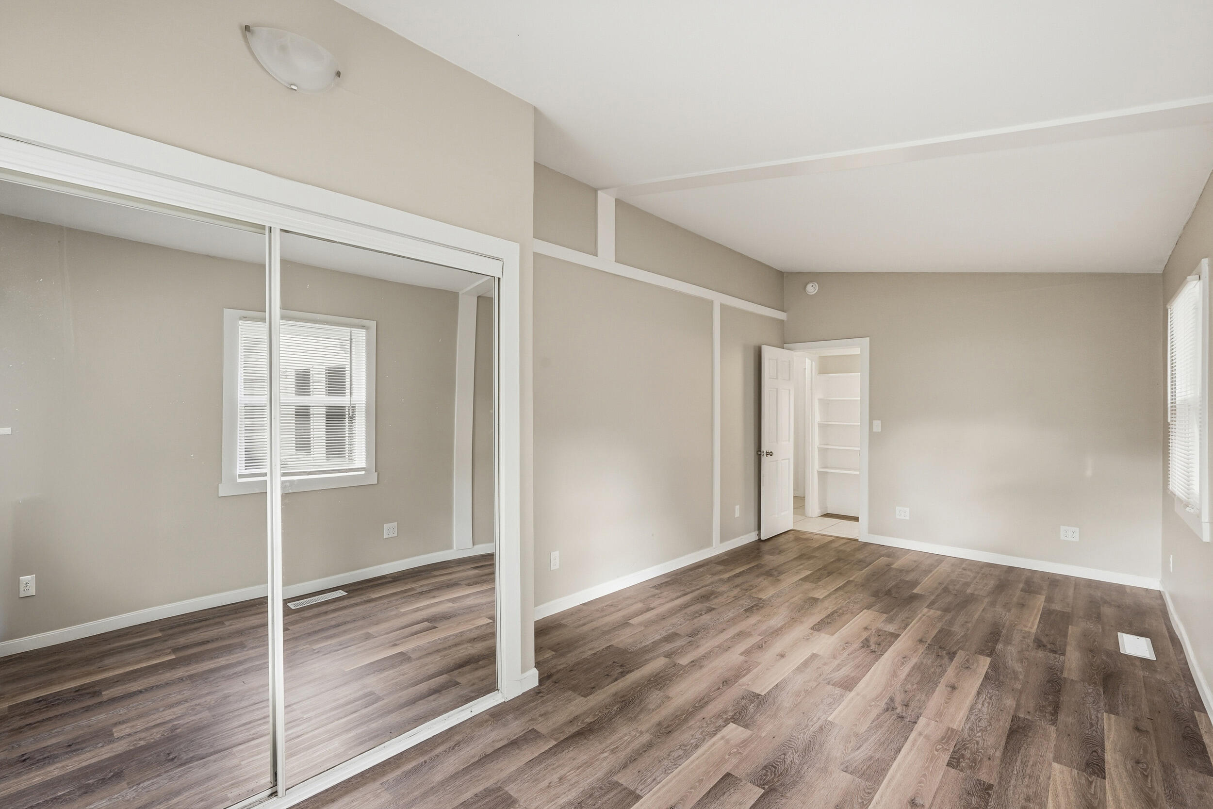 319 Michigami Trail Chesterton, IN 46304 - Photo 11 of 19 a view of an empty room with wooden floor and a window