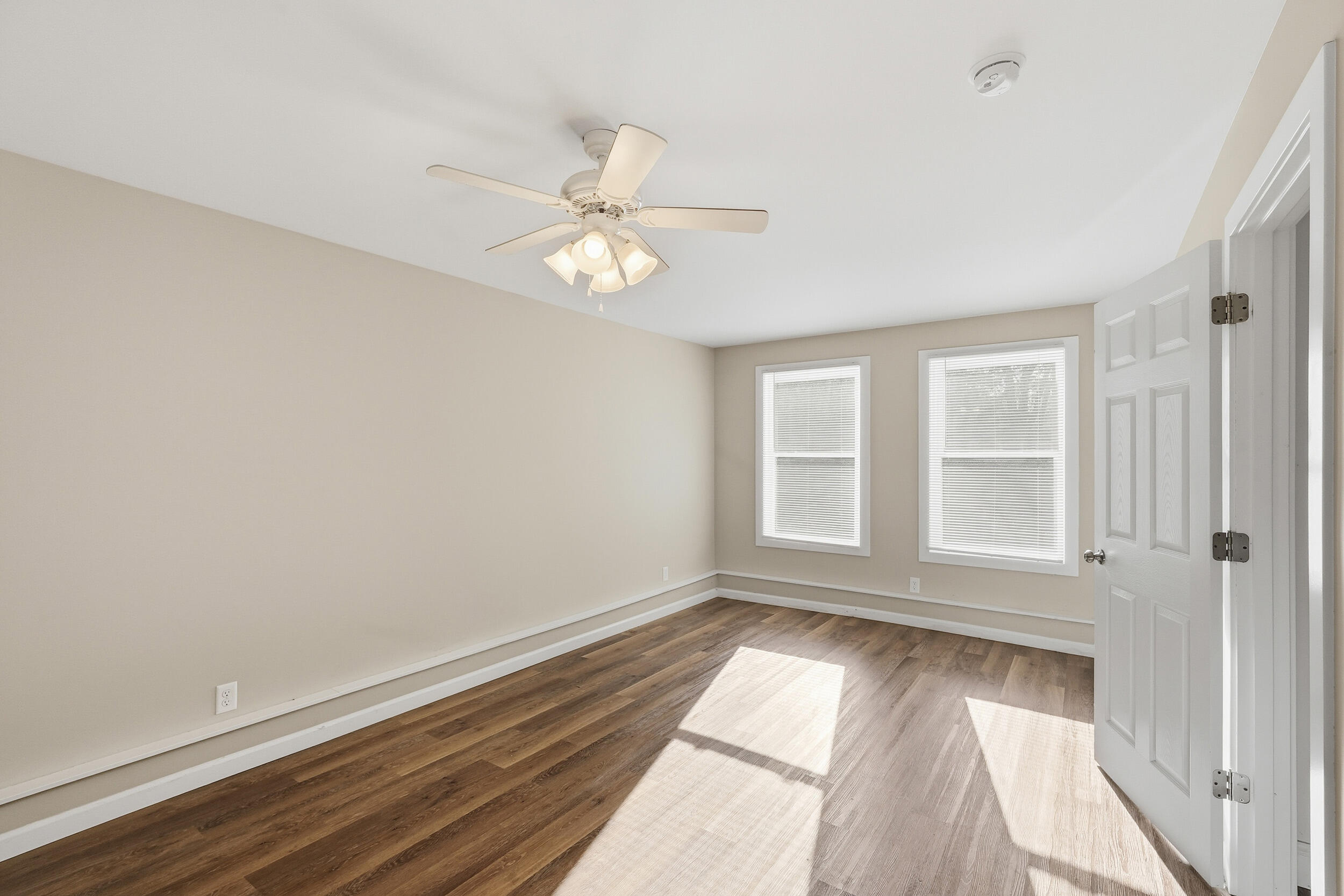 319 Michigami Trail Chesterton, IN 46304 - Photo 14 of 19 wooden floor in an empty room with a window