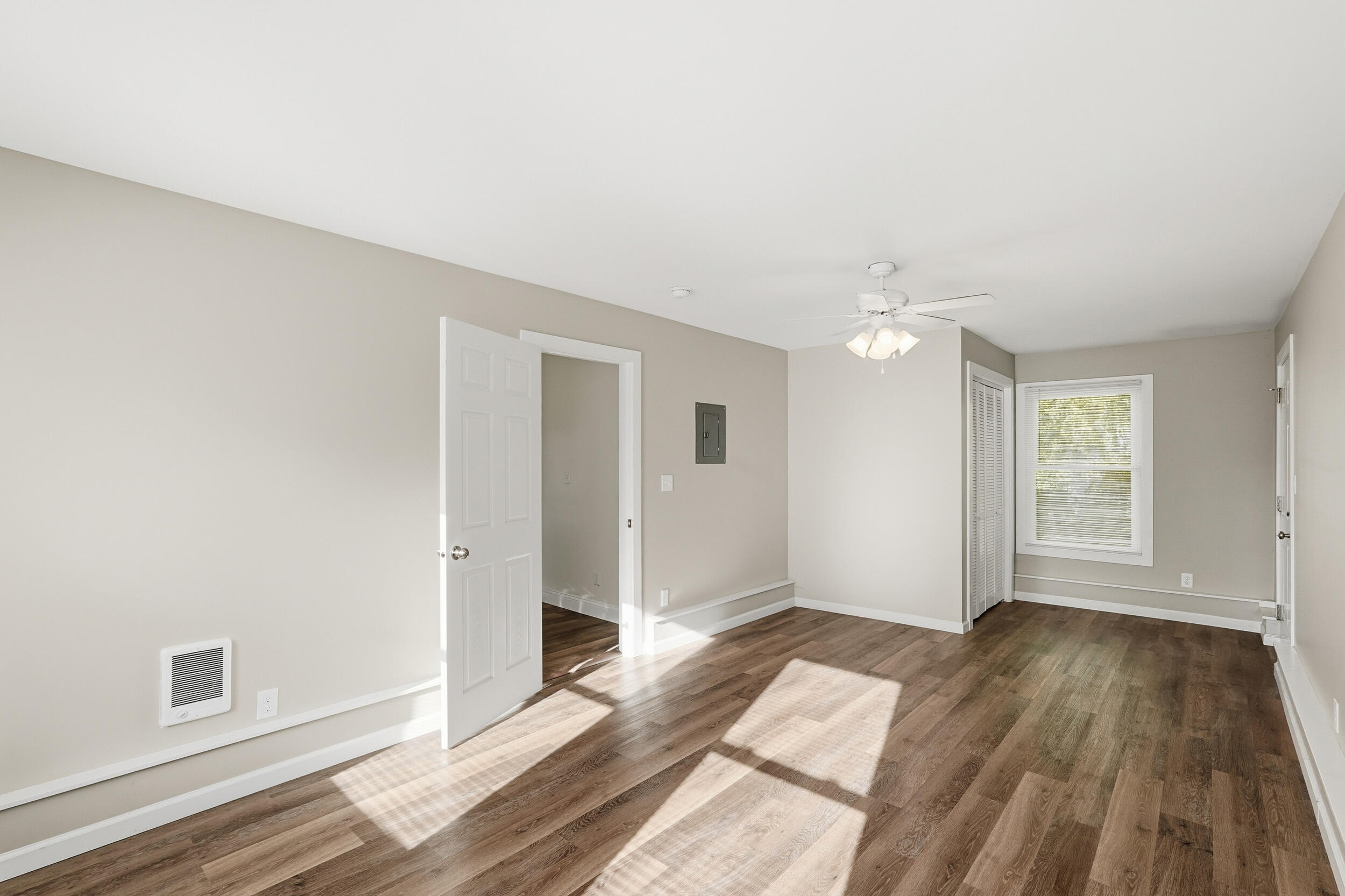 319 Michigami Trail Chesterton, IN 46304 - Photo 14 of 19 an empty room with wooden floor and windows