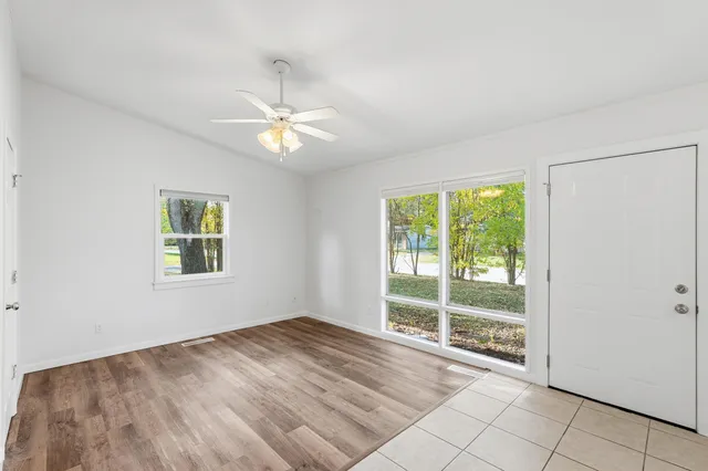 a view of an empty room with a window