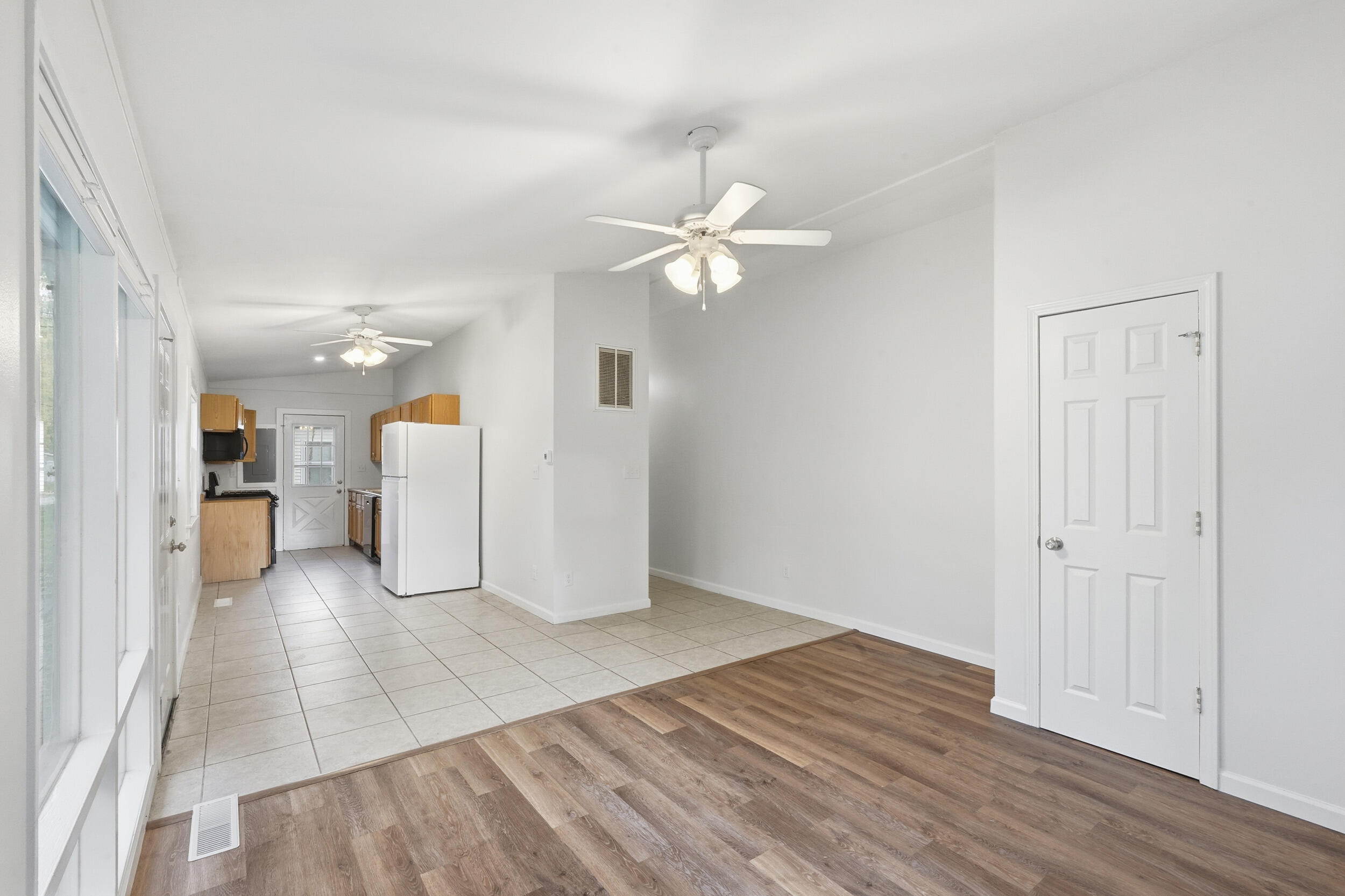 319 Michigami Trail Chesterton, IN 46304 - Photo 3 of 19 an empty room with wooden floor and ceiling fan