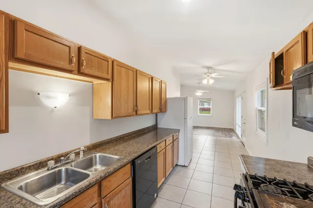 a kitchen that has a sink and a stove