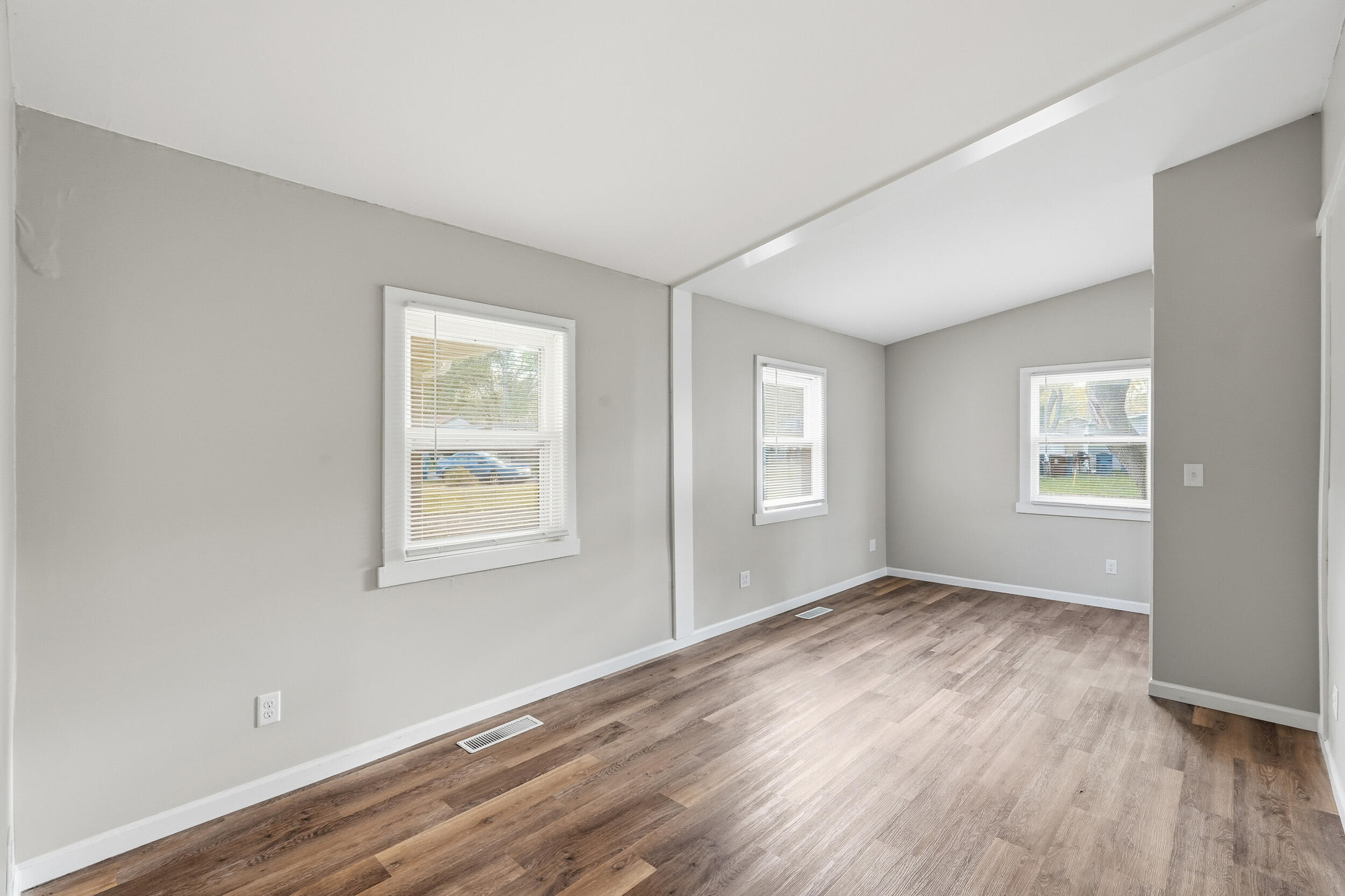 319 Michigami Trail Chesterton, IN 46304 - Photo 10 of 19 an empty room with wooden floor and windows