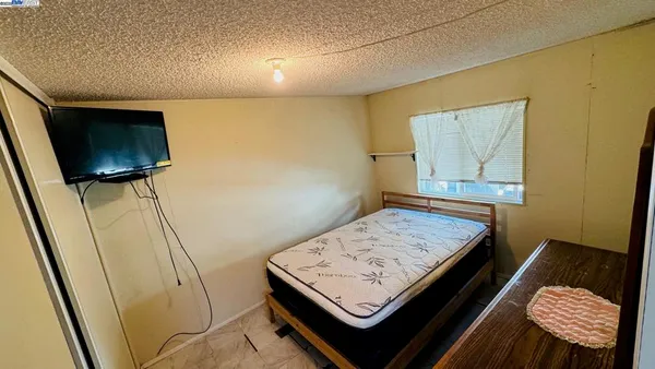 a living room with a couch and a flat screen tv