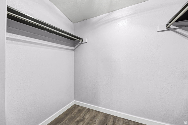 34 Benchmark Village Tooele, UT 84074 - Photo 17 of 35 Walk in closet featuring dark wood-style flooring
