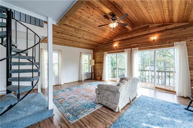 a spacious bedroom with a large bed and a large window