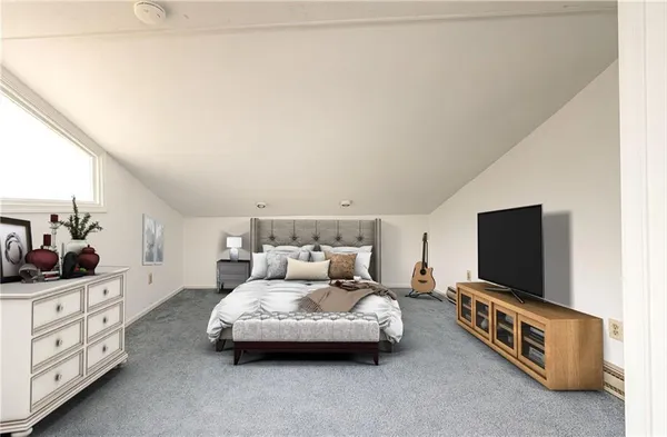 a living room with furniture and flat screen tv