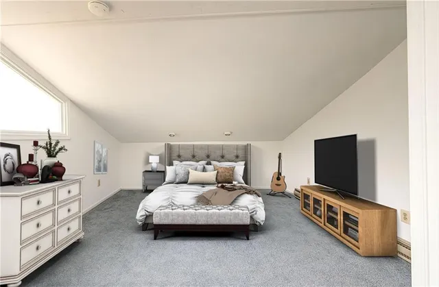 a living room with furniture and flat screen tv