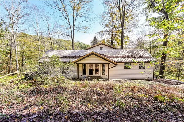 a house with trees in front of it