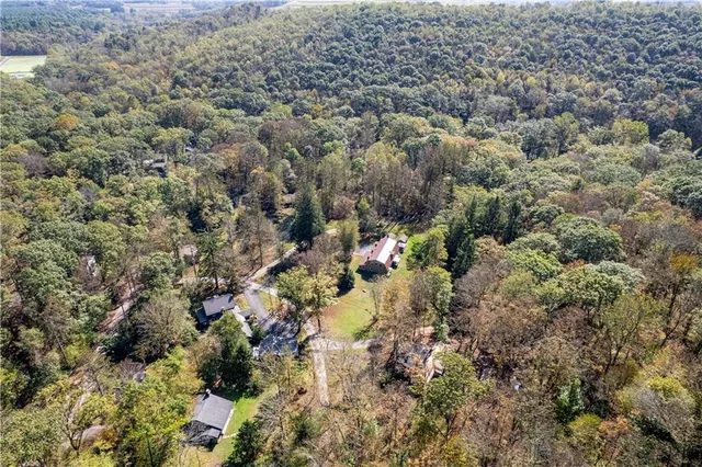 an aerial view of residential houses with outdoor space