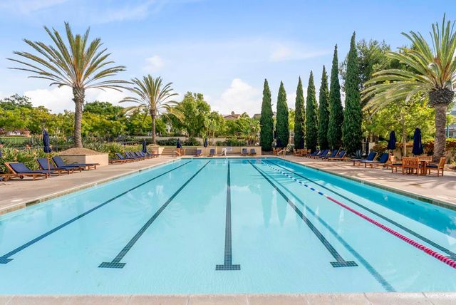 a view of a patio with a table chairs and a fire pit