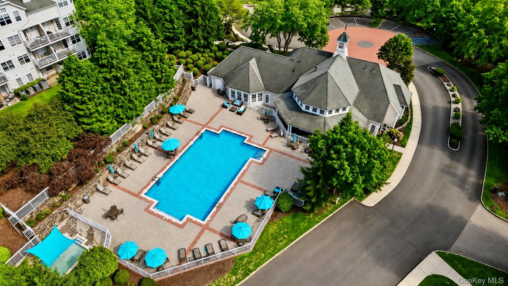 323 Waterside Close Peekskill, NY 10566 - Photo 29 of 42 Expansive outdoor swimming pool and kiddie pool with surrounding paver patio and lounge seating