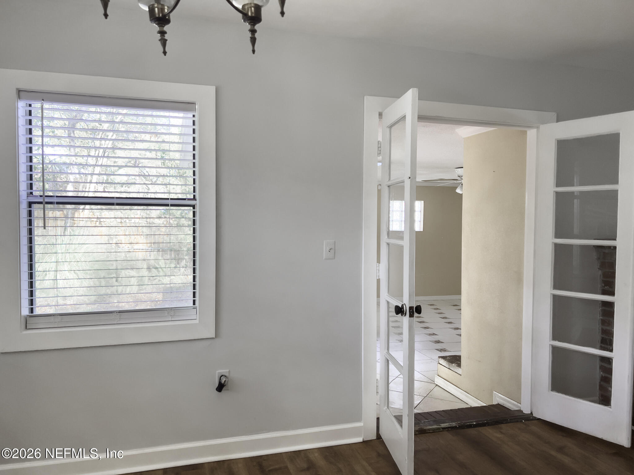 2085 Mills Road Jacksonville, FL 32216 - Photo 12 of 13 a bathroom with a window and a glass door