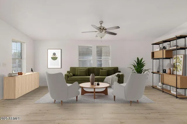 a living room with furniture and a potted plant