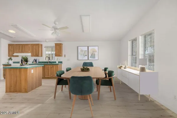 a living room with stainless steel appliances kitchen island granite countertop furniture and a kitchen view