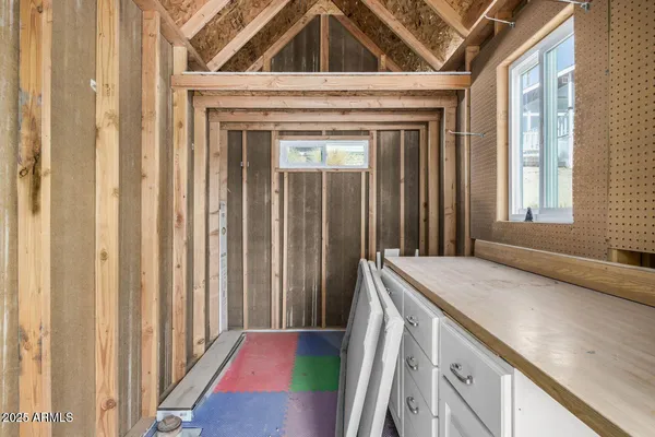a view of an entryway with a kitchen
