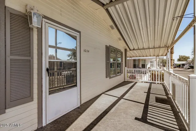 a view of a balcony with wooden floor