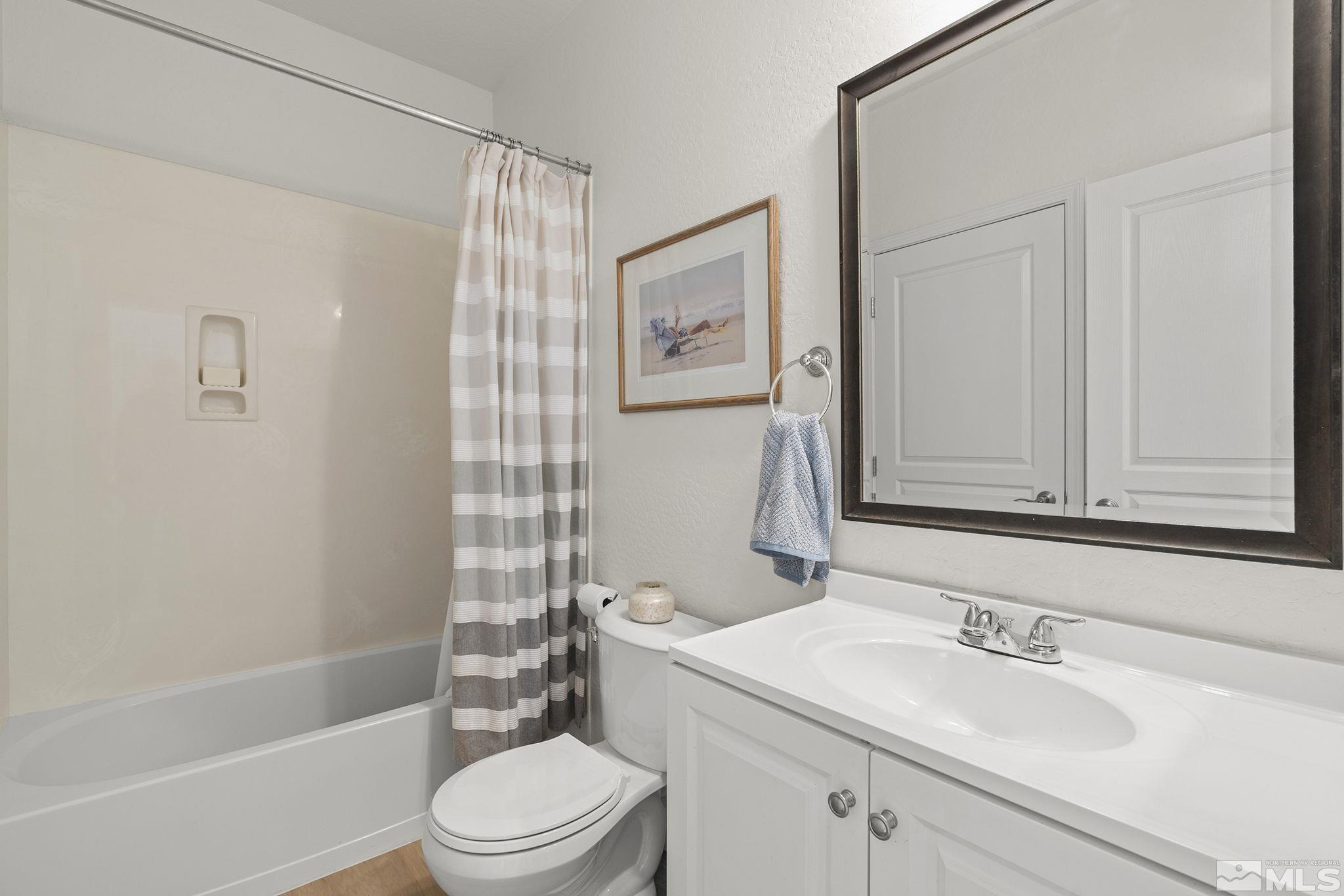 1190 Meridian Ranch Drive Reno, NV 89523 - Photo 21 of 35 a bathroom with a sink a toilet and shower
