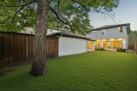 a backyard of a house with lots of green space