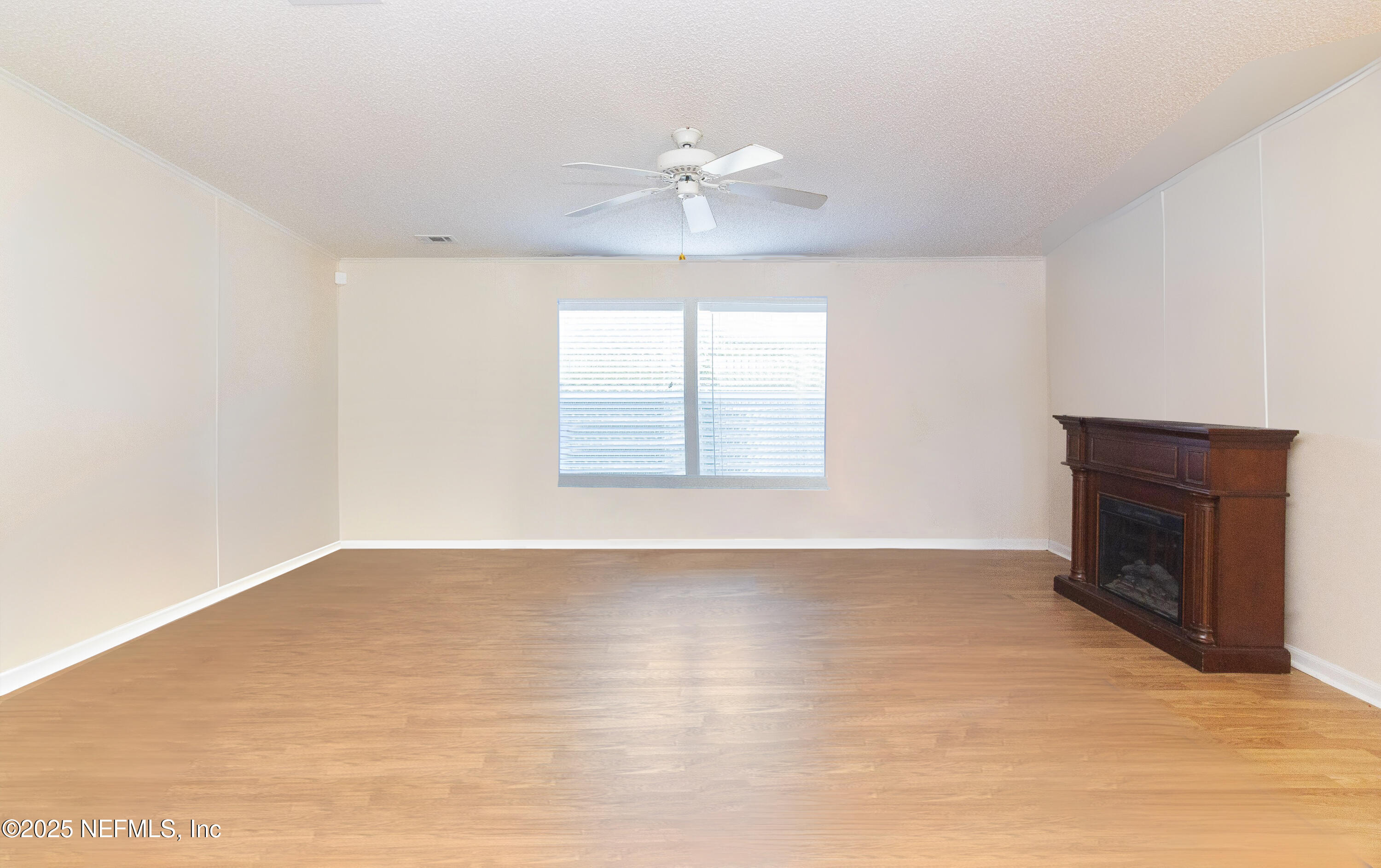 222 Kitty Avenue Interlachen, FL 32148 - Photo 11 of 34 a view of an empty room with a window