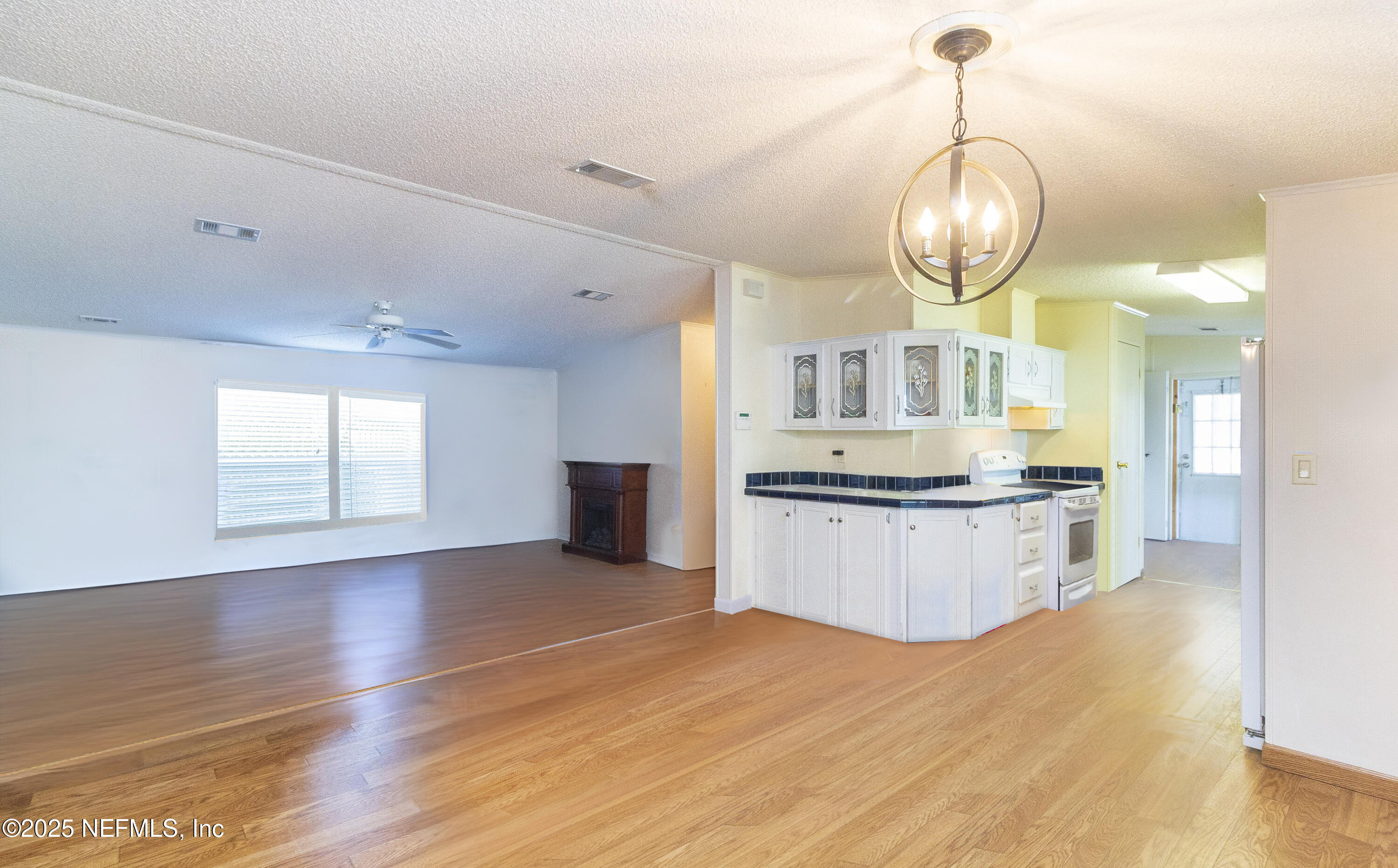 222 Kitty Avenue Interlachen, FL 32148 - Photo 14 of 34 a large kitchen with stainless steel appliances kitchen island granite countertop a table and chairs in it
