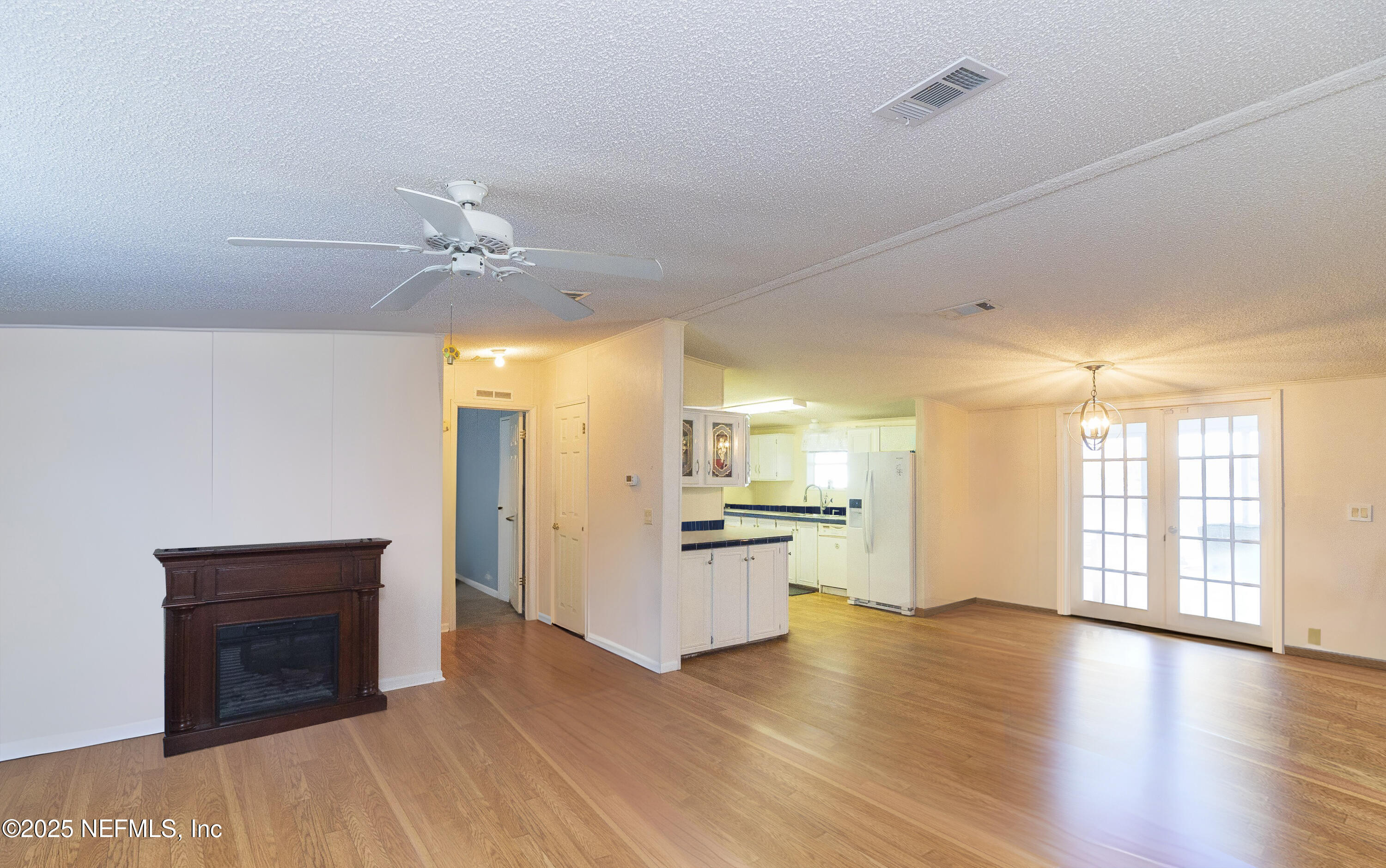 222 Kitty Avenue Interlachen, FL 32148 - Photo 15 of 34 a view of a kitchen with a sink and a stove top oven