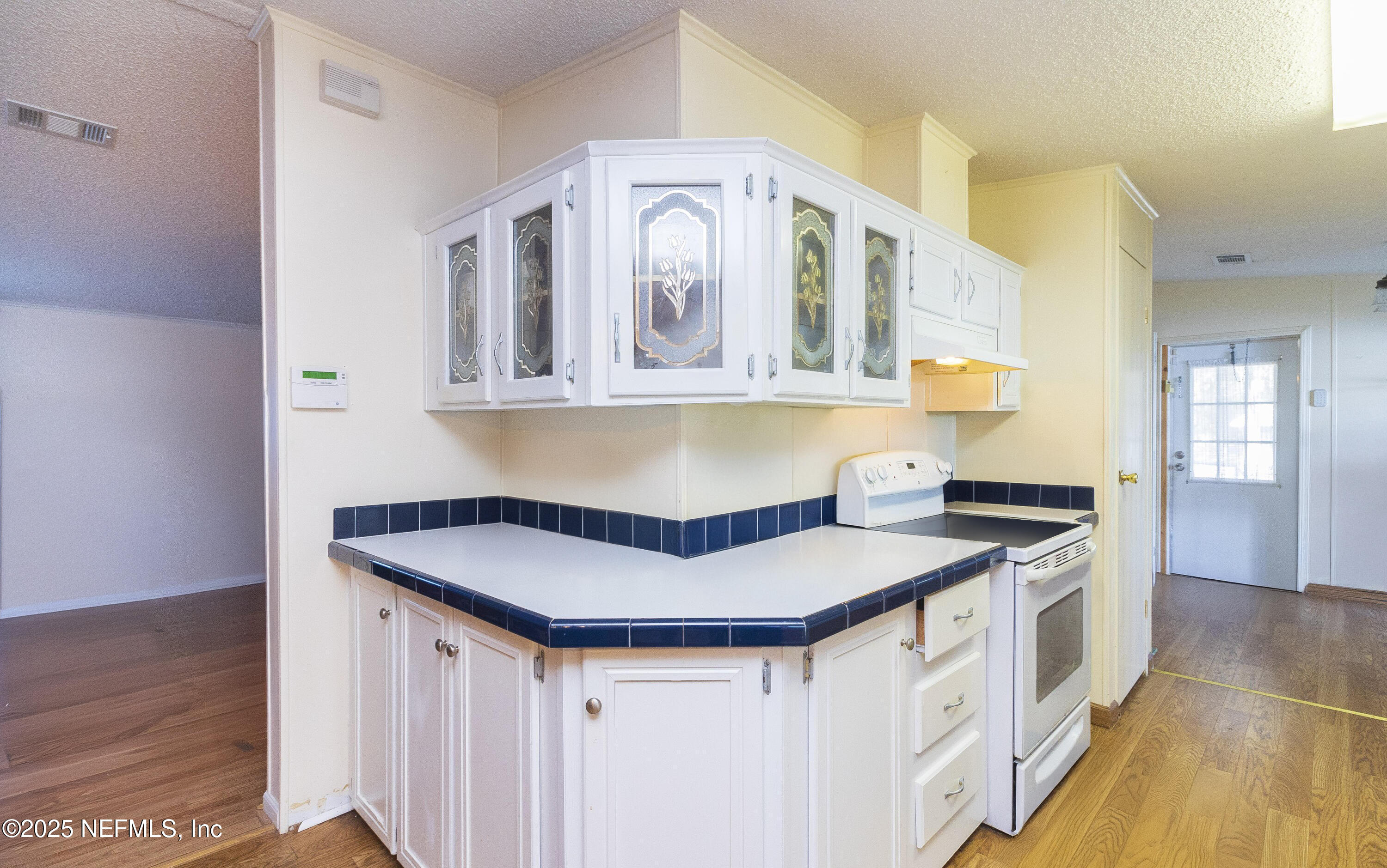 222 Kitty Avenue Interlachen, FL 32148 - Photo 18 of 34 a kitchen with stainless steel appliances granite countertop a sink and cabinets