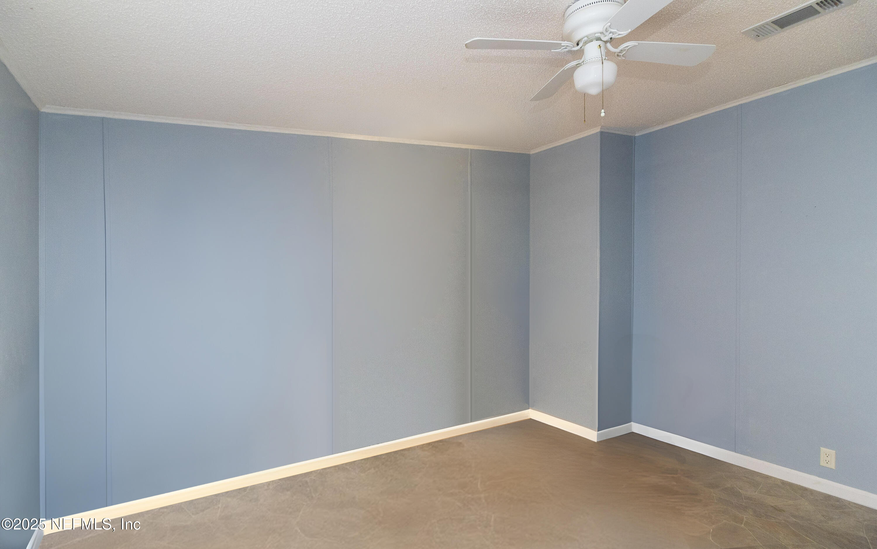 222 Kitty Avenue Interlachen, FL 32148 - Photo 25 of 34 an empty room with a fan & a window