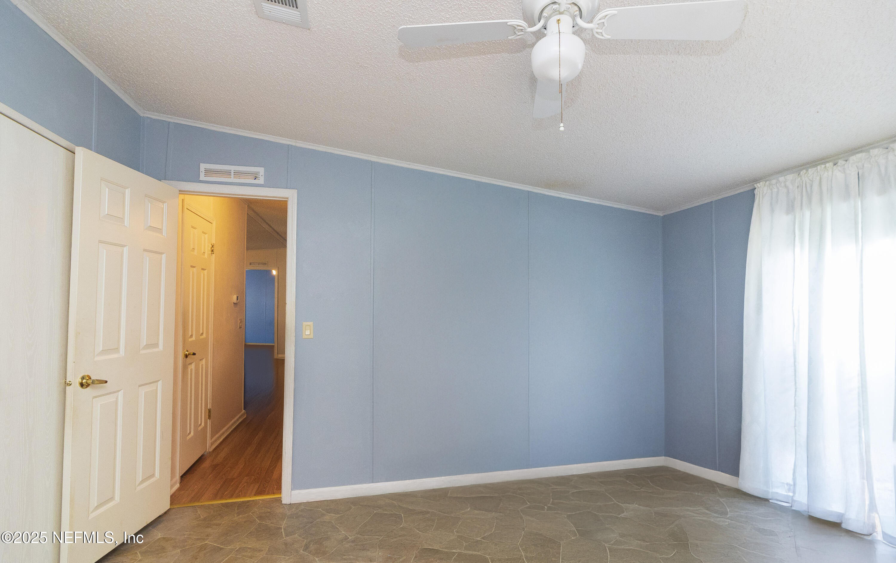 222 Kitty Avenue Interlachen, FL 32148 - Photo 27 of 34 a view of an empty room with a window
