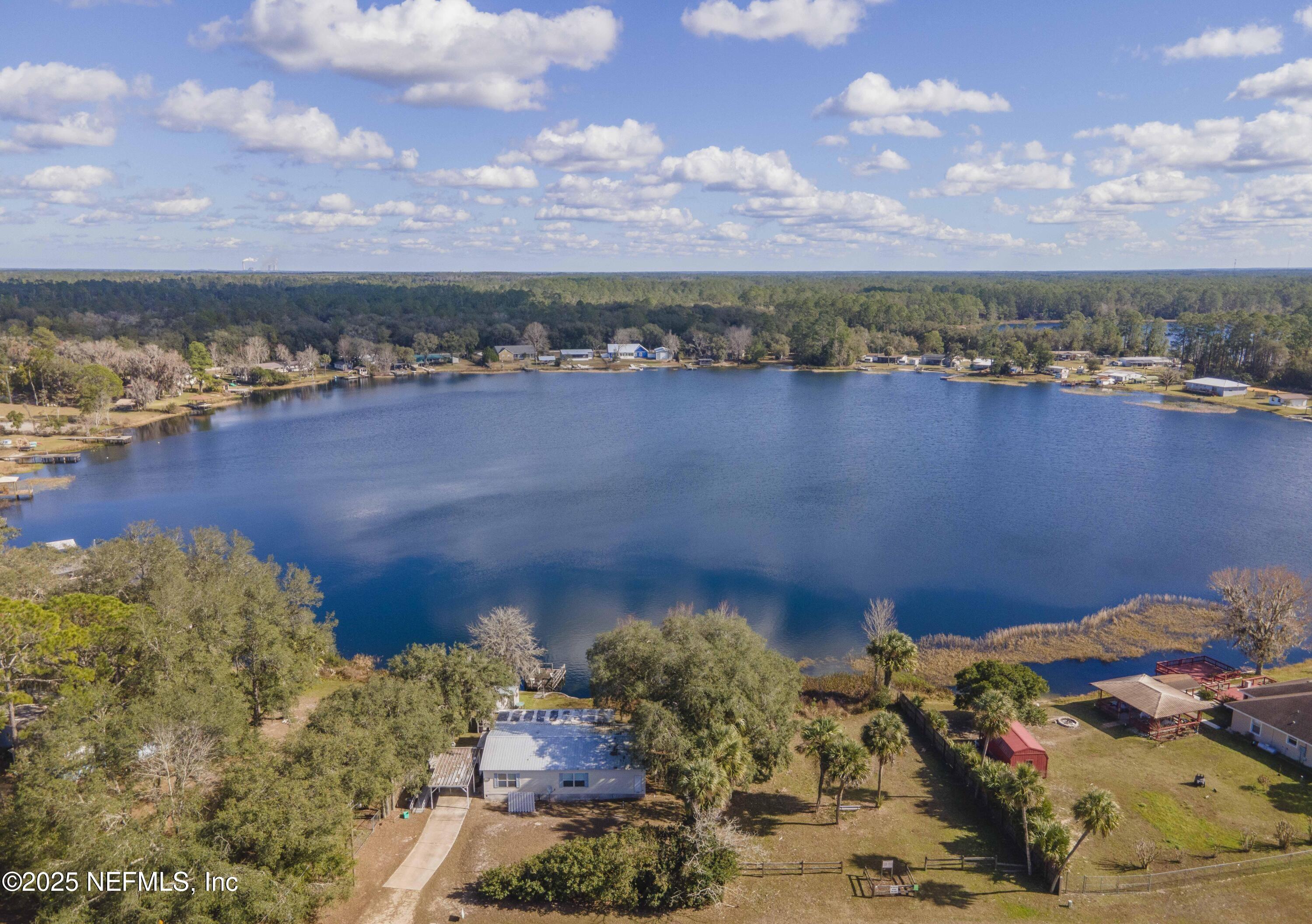 222 Kitty Avenue Interlachen, FL 32148 - Photo 3 of 34 a view of a lake with a mountain