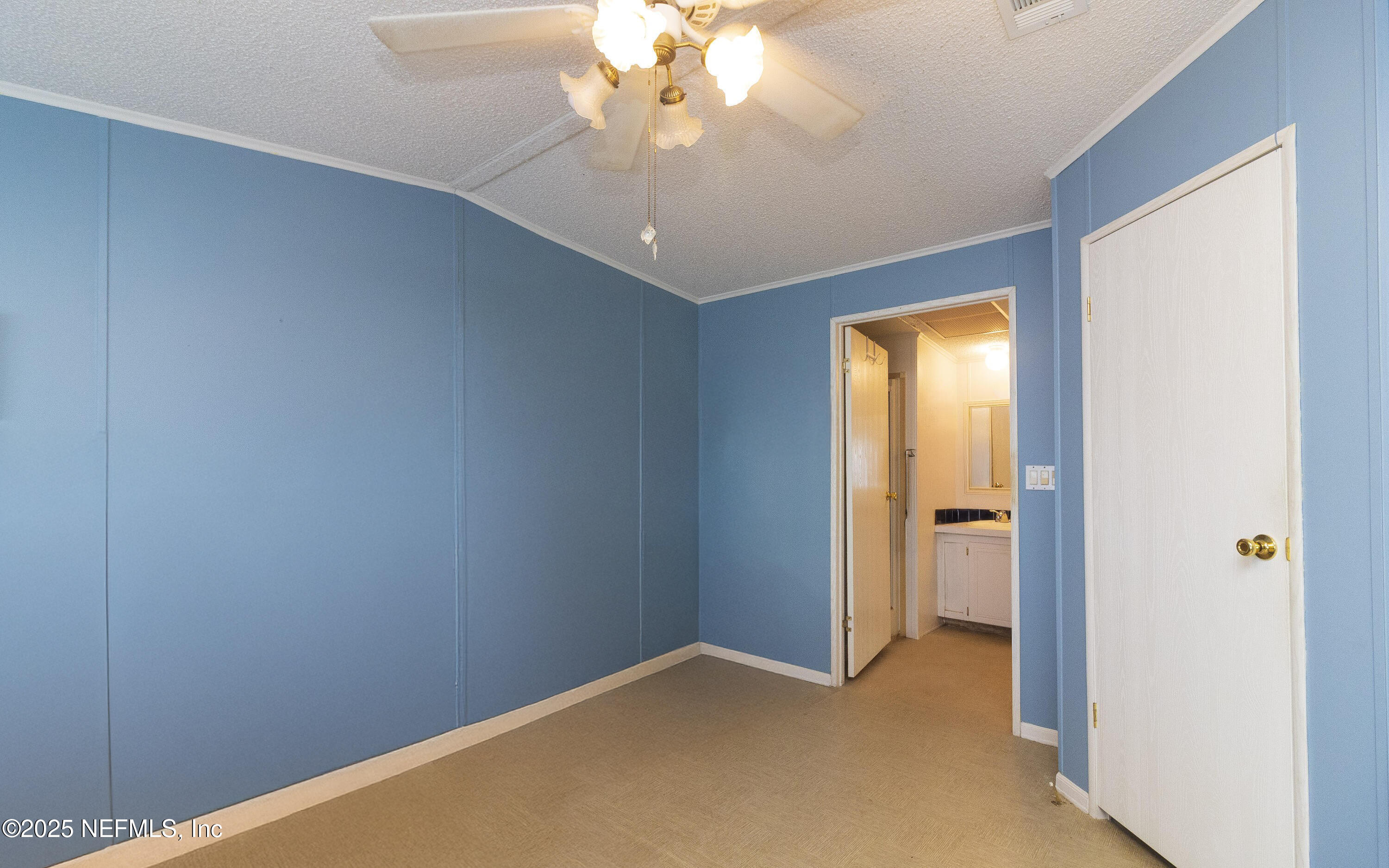 222 Kitty Avenue Interlachen, FL 32148 - Photo 31 of 34 a view of an empty room and chandelier fan